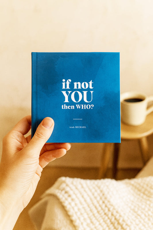 hand holding pocket sized inspiration book for teens and adults